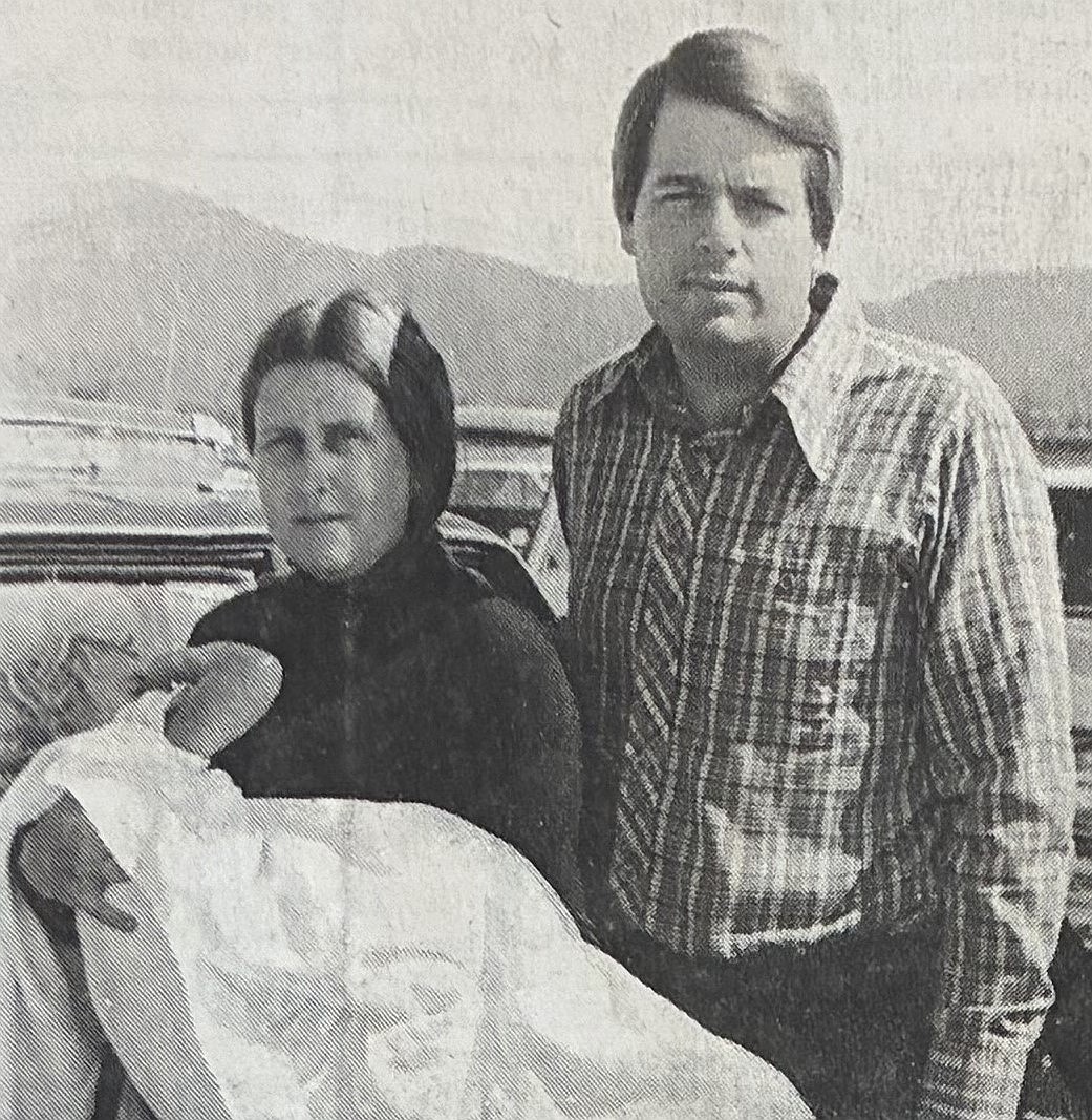 Rob and Dawn Aldridge hold their rescued child in 1980.