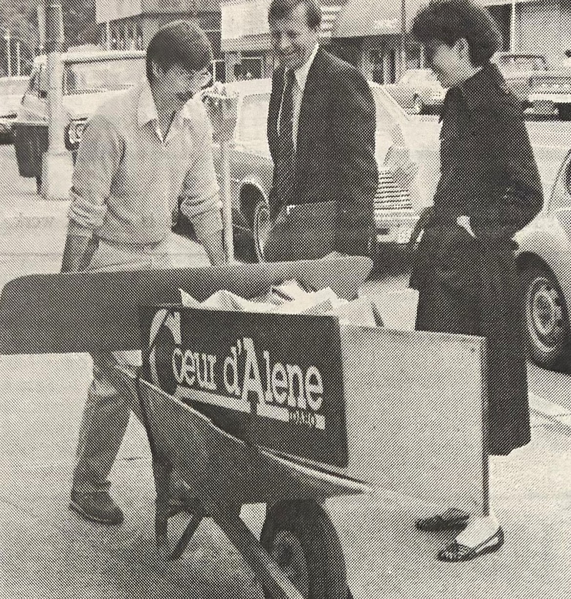 Sandy Emerson moves chamber of commerce items to a new Sherman Avenue location in 1985. Also pictured are Jim Faucher and Sylvia Waterson of Kootenai Medical Center.