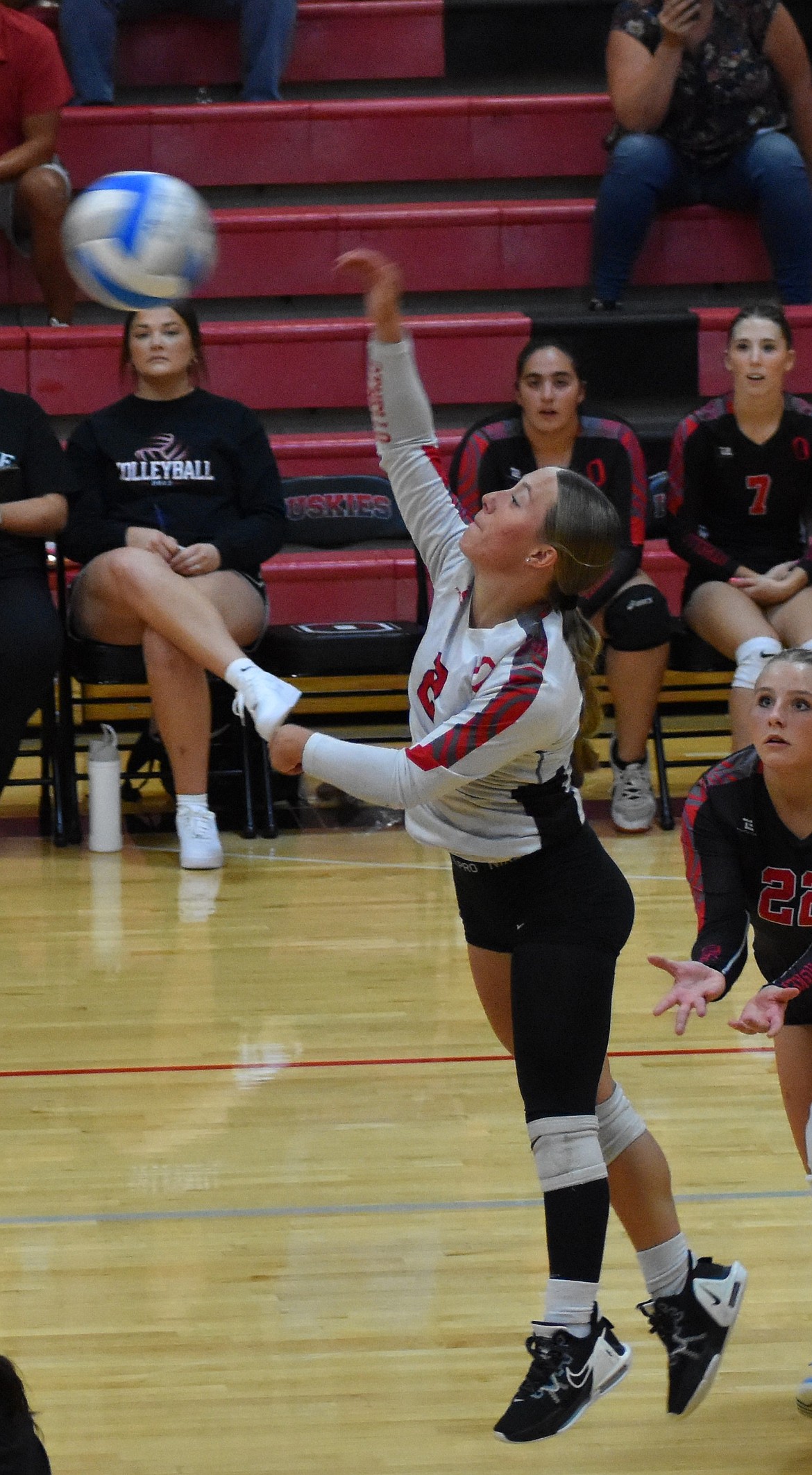 Whitlee Hollenbeck from the Huskies jumps up to hit the ball back to the opposing Mavs. Huskies coach Steve Parris said that Hollenbeck had a strong performance on the court Tuesday and made her presense known.