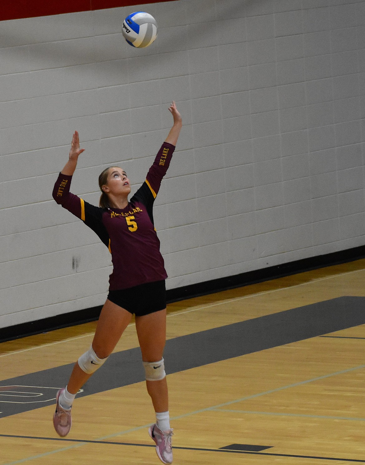Mavs player Madison Witwer prepares to serve the ball during the first set against the Huskies on Tuesday. Witwer said that moving forward the team will benefit from playing with high energy and keeping their minds on what the next play will be.