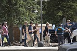 Authorities say student who had been radicalized fired revolver at Colorado school, wounding 2