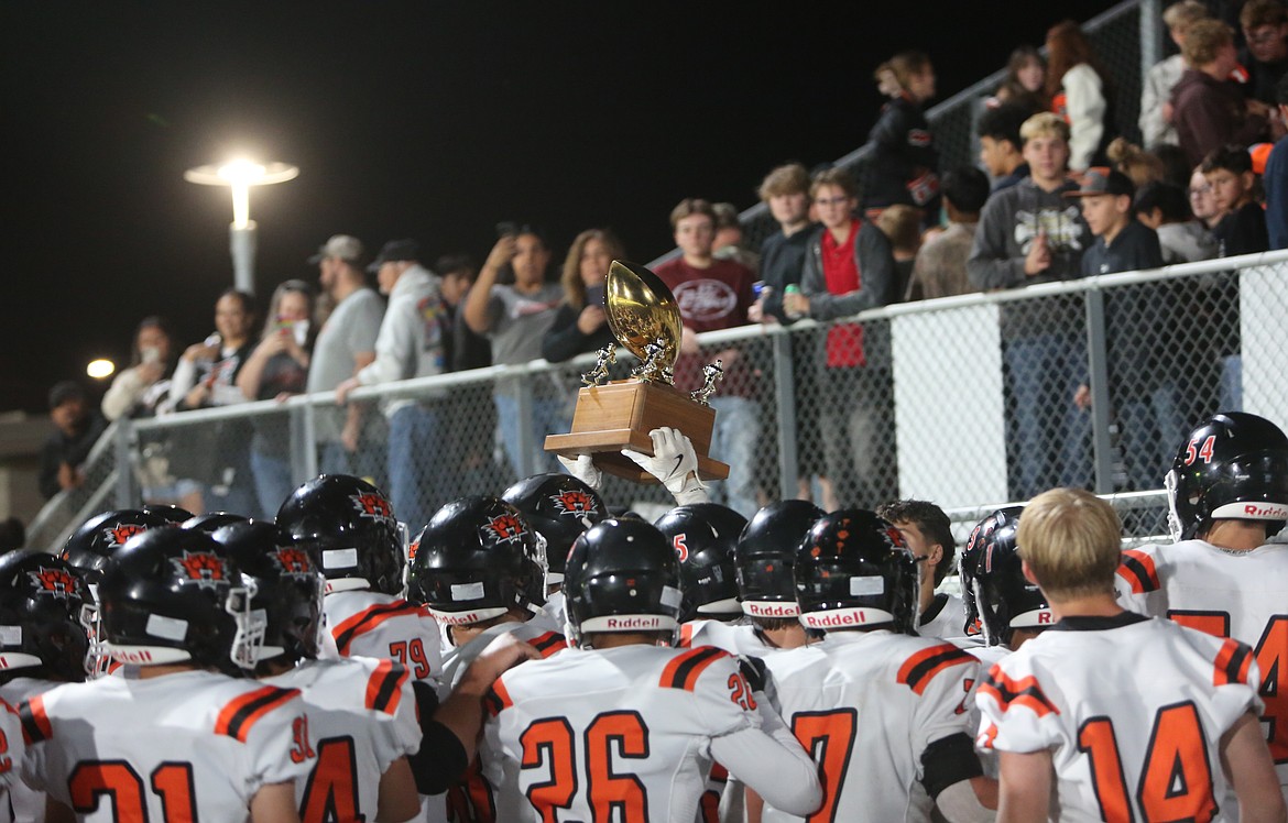 The Ephrata Tigers celebrate as a team after winning the Battle of the Basin trophy on Friday. The Tigers defeated the Jacks 49-14 on the road.