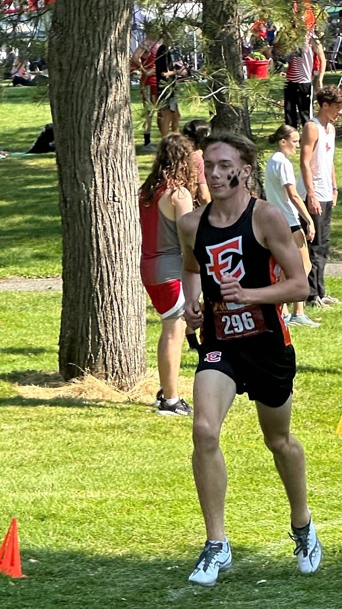 Tigers sophomore Caleb Fitts runs during the Highlander Invitational over the weekend. Fitts finished the 2.5-mile race with a time of 13:46.49.