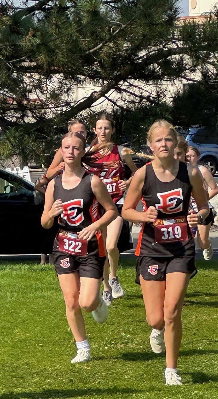 Ephrata sophomores Madison Harmon and Jillian Bair run side by side during the Highlander Invitational. Harmon finished the race with a time of 22:15.34 and Bair finished with 23:05.52.