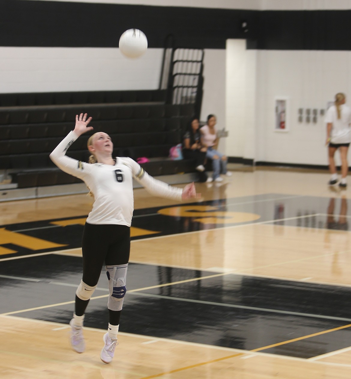 The Knights’ Ava Lawrence (6) serves the ball against Cashmere. The Knights ultimately fell short 3-0 at home, but Head Coach Lisa Lawrence said her team showed a lot of fight and improvement throughout.