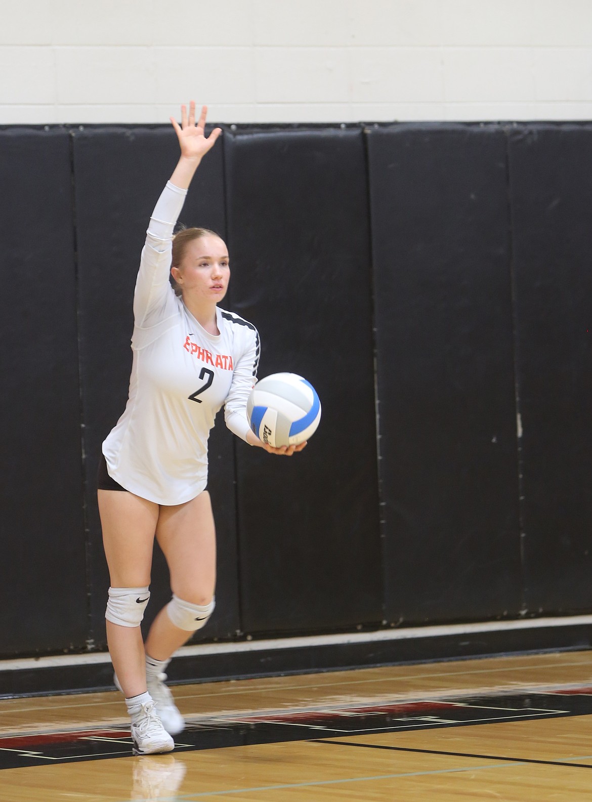 The Tigers’ Alyssa Dymarkowski (2) prepares to serve the ball against the Huskies on Tuesday. The Tigers won the second set 25-15.