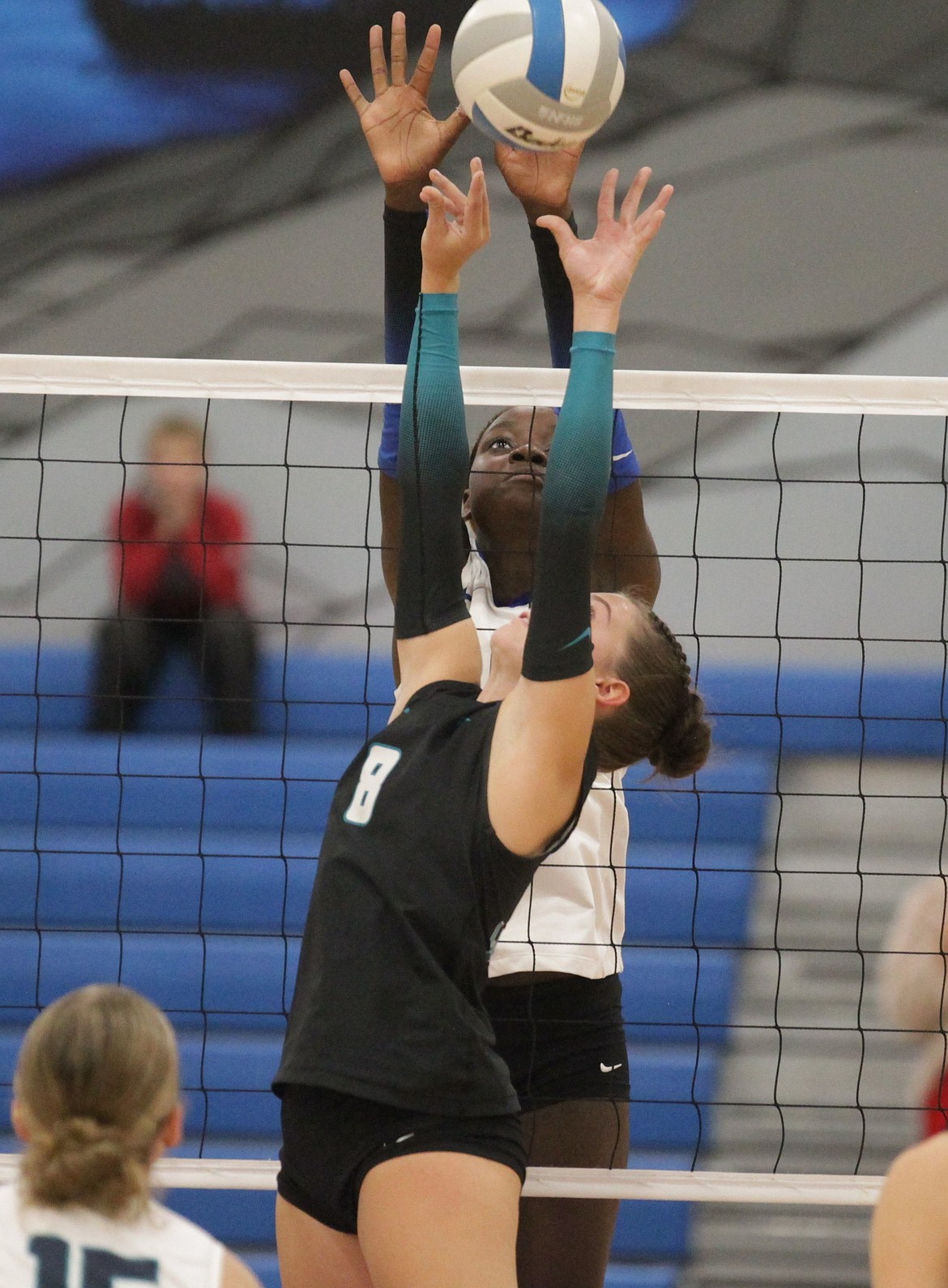 MARK NELKE/Press
Coeur d'Alene junior Jovie Le blocks as Lake City senior Miranda FitzSimmons (8) sets on Thursday night at Coeur d'Alene High.
