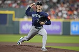 Suárez homers and Woo exits after 5 innings as Mariners beat Astros 4-0 to take over 1st in AL West