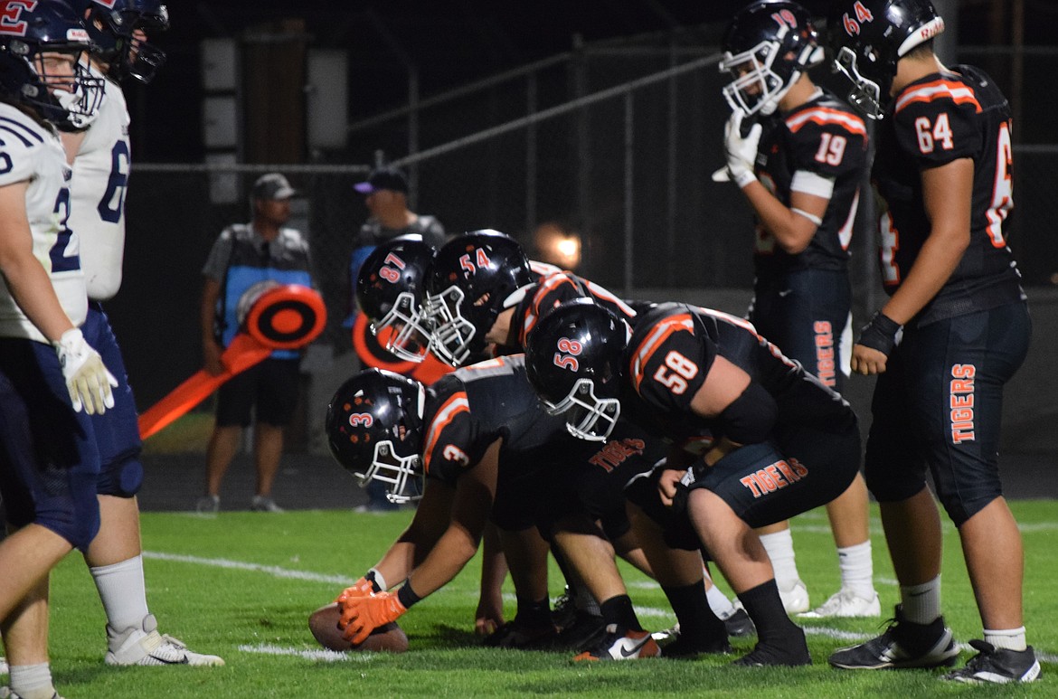 The Tigers’ offensive linemen get ready to hike the ball against Ellensburg. Head coach Patrick Mitchell said the offensive line played a major role in the teams success as they opened holes for the running backs to make huge plays.