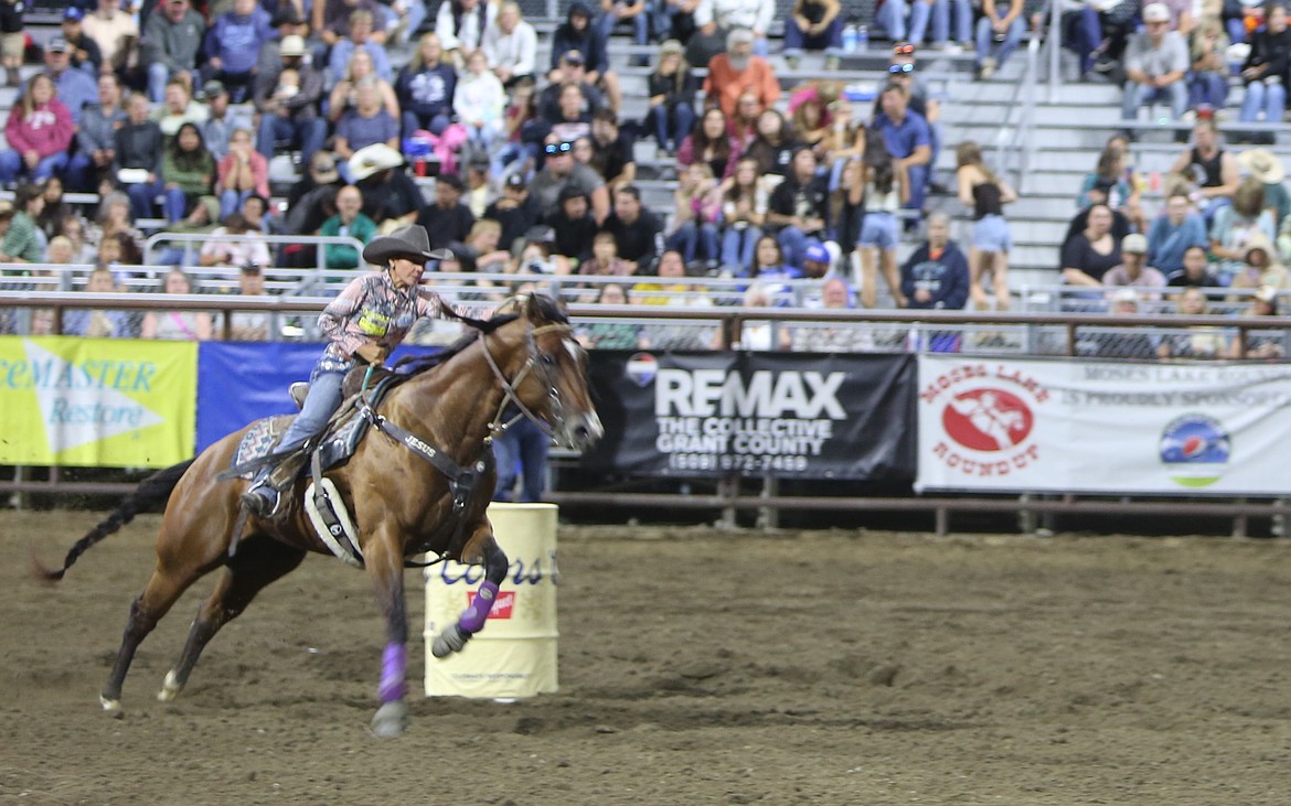 A barrel racer darts around a barrel during the Moses Lake Roundup at the Grant County Fair. Another barrel race hosted by the Washington Cutting Horse Association will be held from Oct. 8-12 in the Harwood Pavillion Arena.