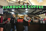 Starbucks to close hundreds of stores, lay off 900 workers as part of turnaround plan