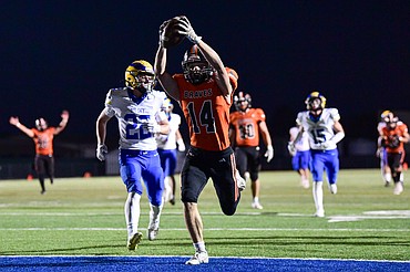 Flathead running back Brett Chivers (14) scores a touchdown on a 28-yard reception in the second quarter against Missoula Big Sky at Legends Stadium on Friday, Sept. 26. (Casey Kreider/Daily Inter Lake)