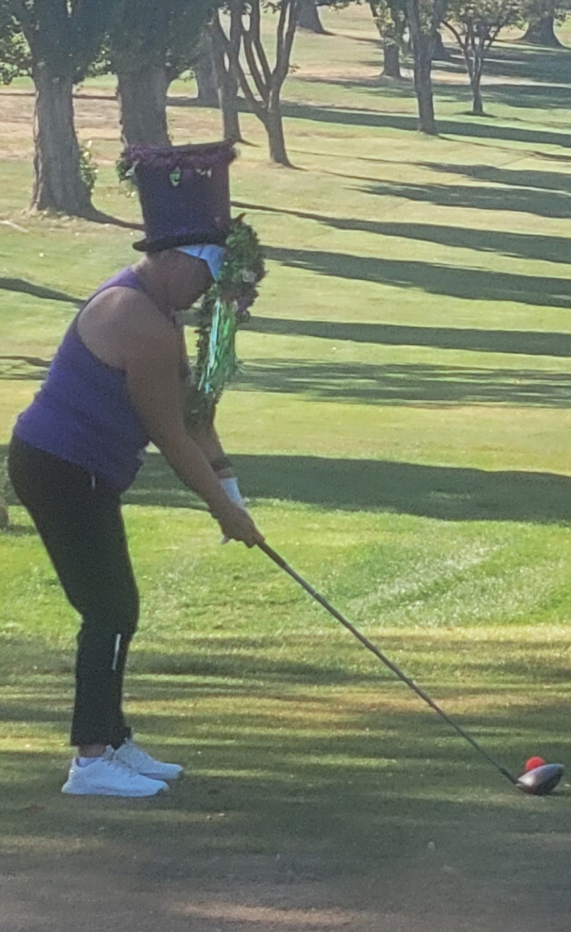 A golfer at the “Dude! Where’s my Cart!?” charity golf tournament tees off with glasses that augment their vision. Event organizer Karisti Cox said each hole had a challenge related to experiences people with Alzheimer’s face.
