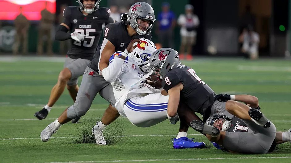 Cougars Anthony Palano (0) and Caleb Francl (9) combine for a tackle against Colorado State on Saturday. The Cougars got back in the win column, defeating the Rams 20-3 on the road.