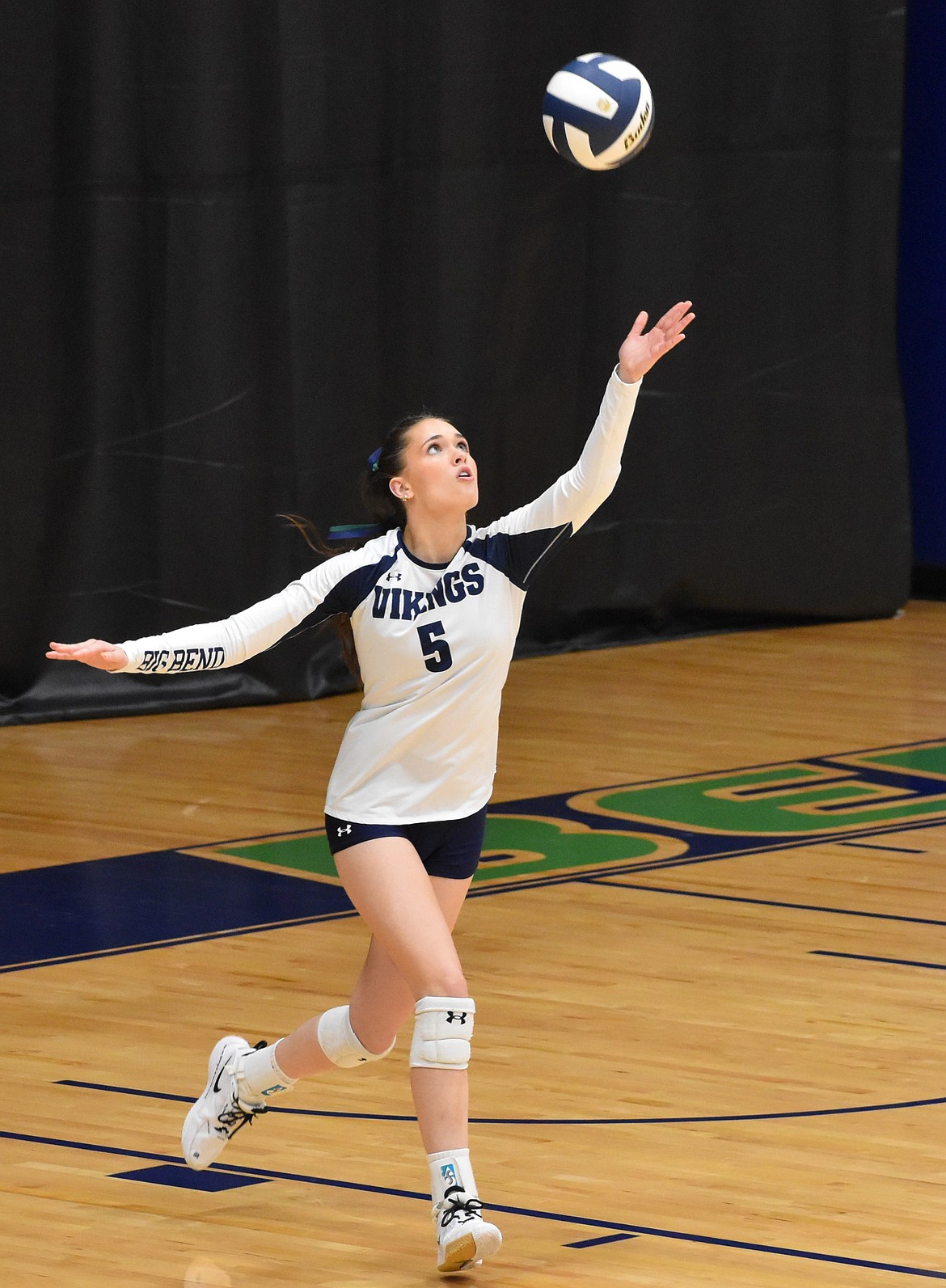 Charley Utley from the Vikings prepares to serve the ball against Columbia Basin College. Head coach Lindsey Linthicum said that the young team is still coming together but is making great progress in its season.