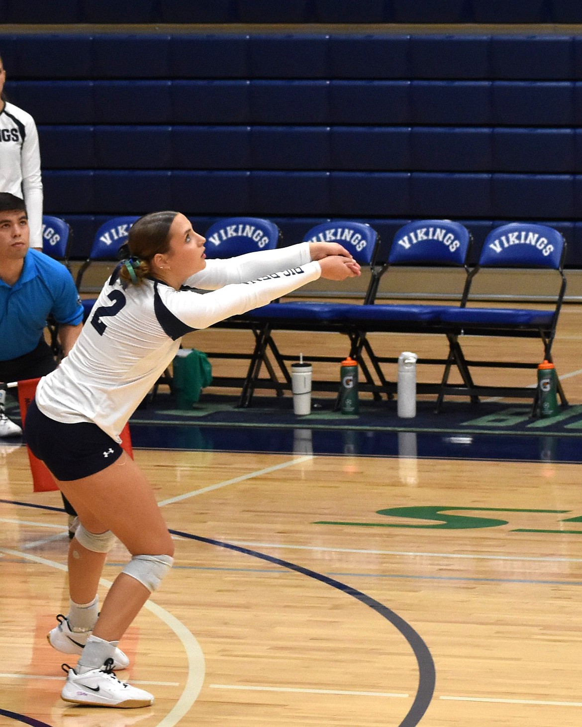 Raegan Golladay bumps the ball over the net in the Vikings' game against Columbia Basin College. Head coach Lindsey Linthicum said the team made a great effort in working together and communicating during the last two sets.