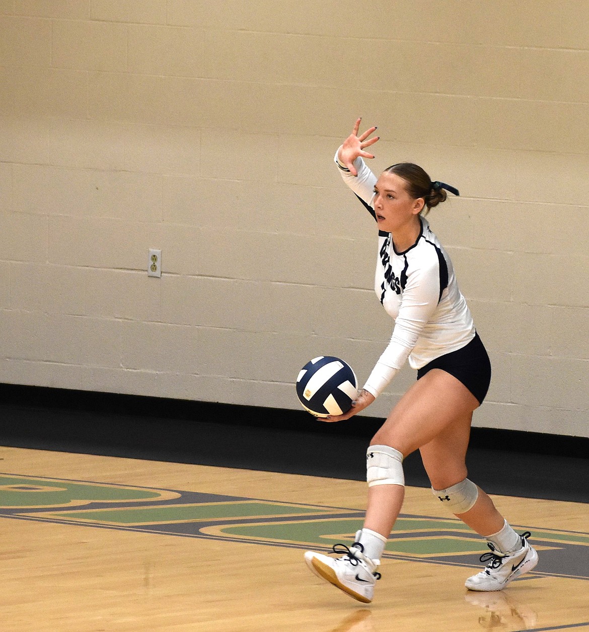Edyn Marlatt from the Vikings prepares to serve the ball during the second set against Columbia Basin College.