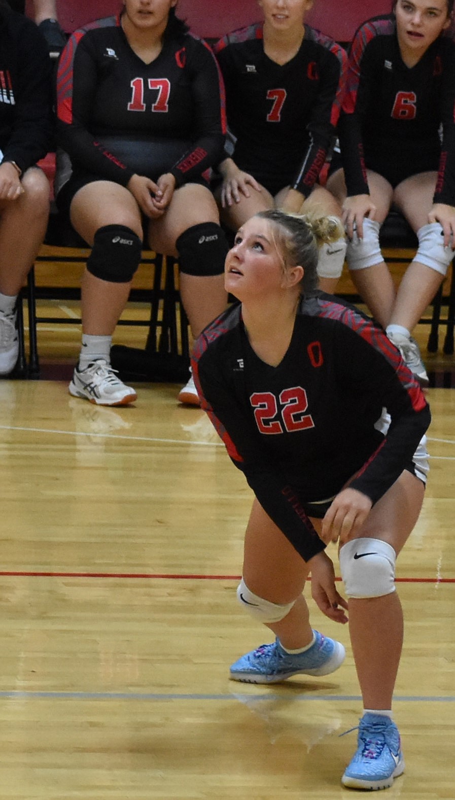 Addie Roylance of the Huskies sets herself up to hit the ball during Monday’s game. She said that the loss in the third set ignited the team to push for their victory in the fourth set.