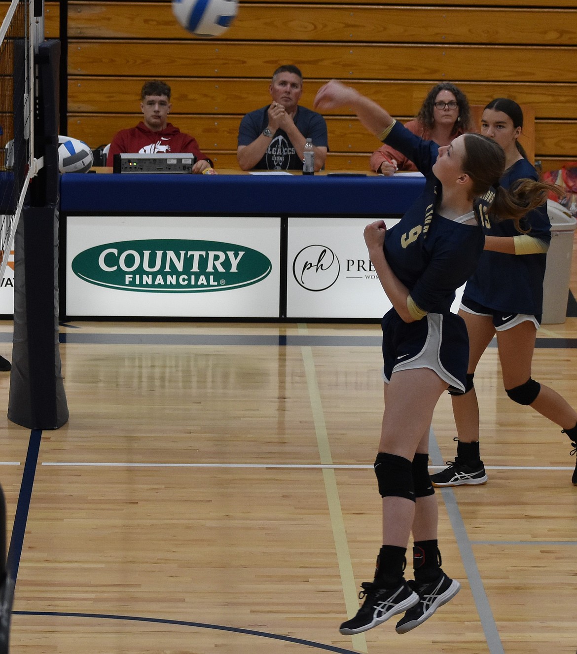 Clarissa Shopbell from the Lions sends the ball back over the net during the game against the Eagles. As the season continues, both teams prepare for shorter days between games.