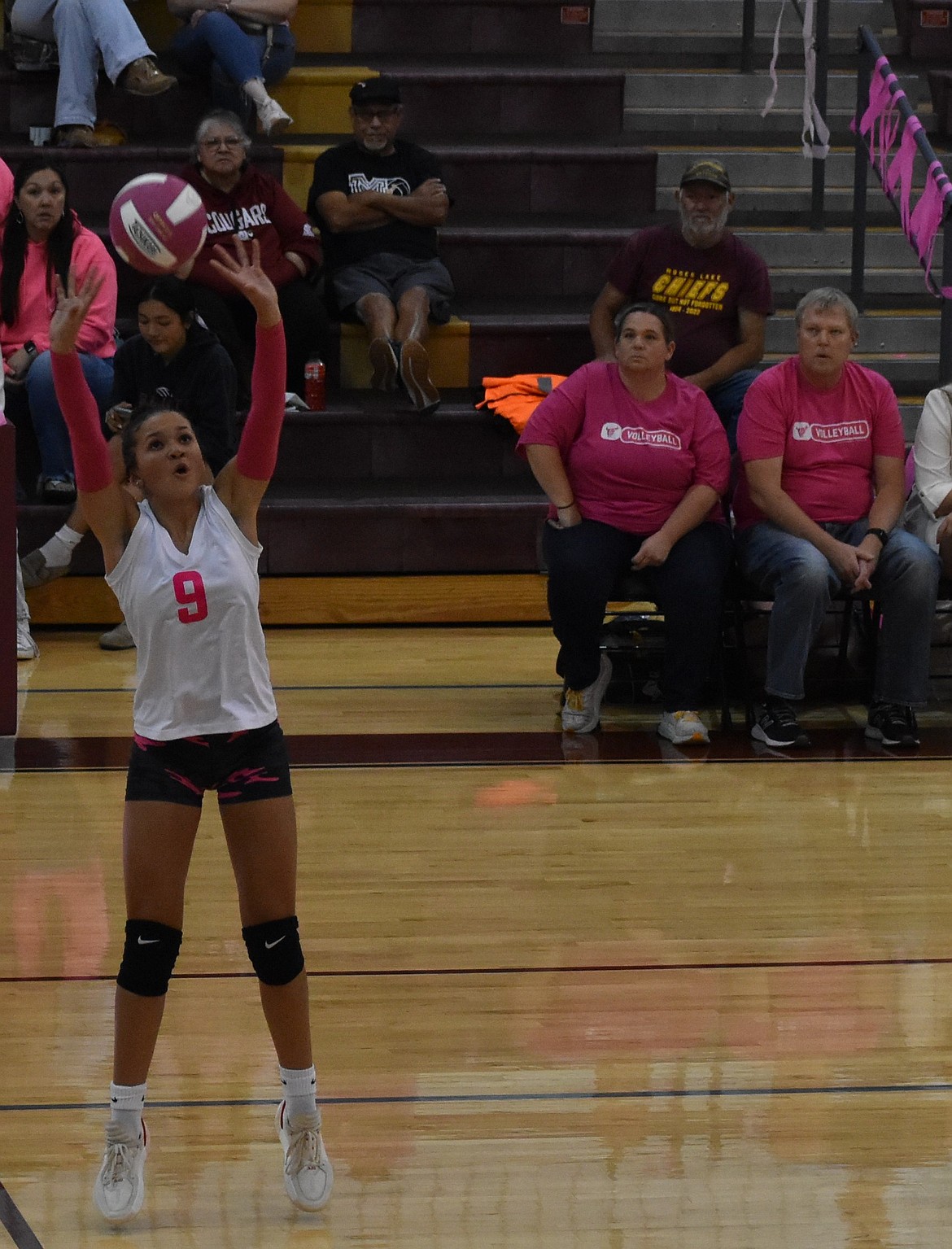Mavs player Allison Bond sets the ball for one of her teammates to go for the spike during the first set against Eisenhower. While the team struggled in the first set, they quickly rebounded to earn the victory.