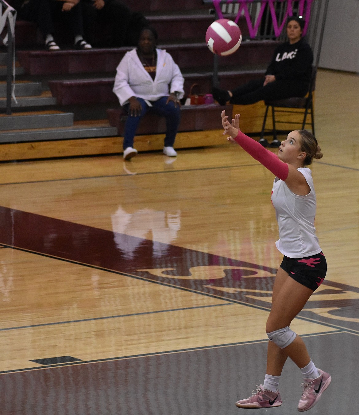 Madison Witwer from the Mavs gets ready to serve the ball to Eisenhower during the fourth set of the night. Witwer said Tuesday’s win gave the team some renewed confidence in themselves.