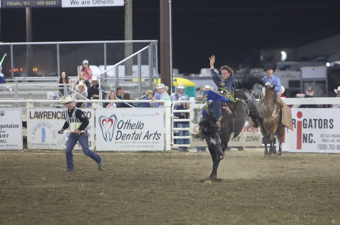 A bareback rider at the Othello Fair holds on to his bucking horse. The Puyallup Rodeo featured multiple horseback competitions including the saddle bronc riding event where the finalists consisted of four Canadian riders.