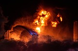 Flames are visible for miles after a fire erupts at a Chevron refinery outside Los Angeles