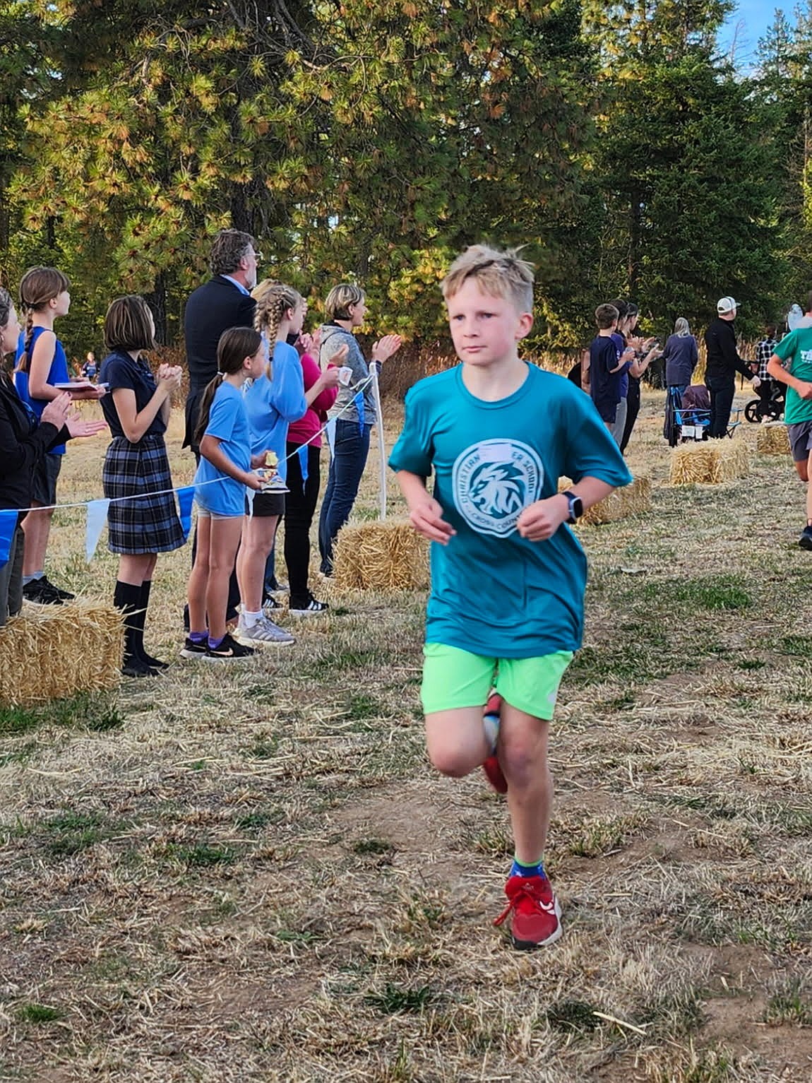 Photo by LUCIA BARTON
Flint Barton with the Christian Center School finishes in fifth place for fifth and sixth grade boys in the Mountain Christian League cross country race on Oct. 3 at Green Bluff in Spokane.