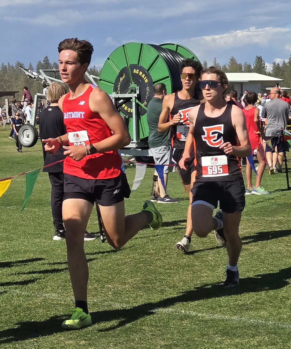 Cooper Black and Niko Diaz from the Tigers run behind an athlete from Eastmont during the Battle for the 509 meet. The boys team earned first in the red division at the meet.