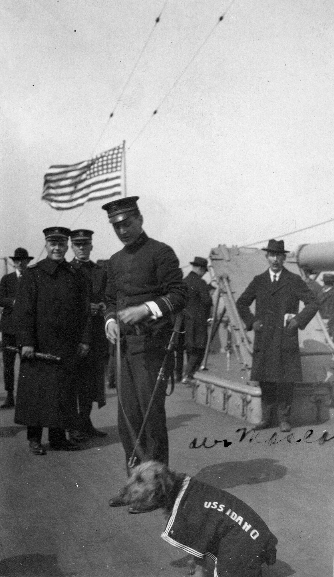 A photo of the USS Idaho (BB-42), the fourth ship named after the state Idaho, including with the ship's mascot. The photo was taken circa 1919.