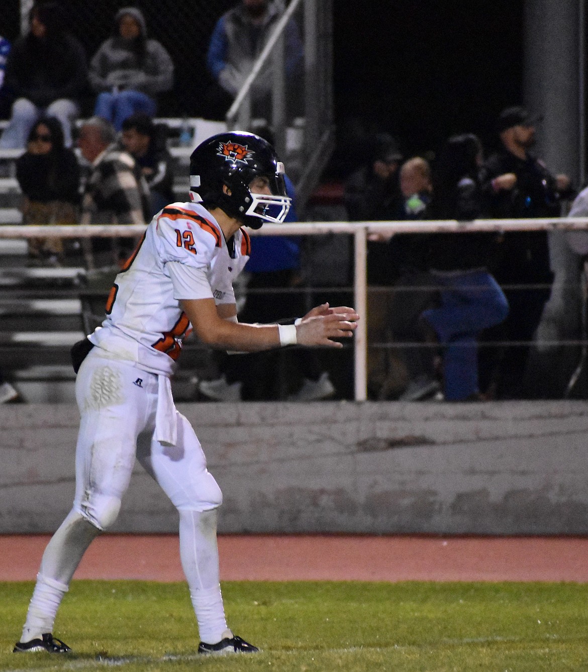 Tigers Quarterback Brady Hendrick prepares to receive the ball to start the play. The Tigers rallied after being down in the third quarter to bring it back to a one score game.