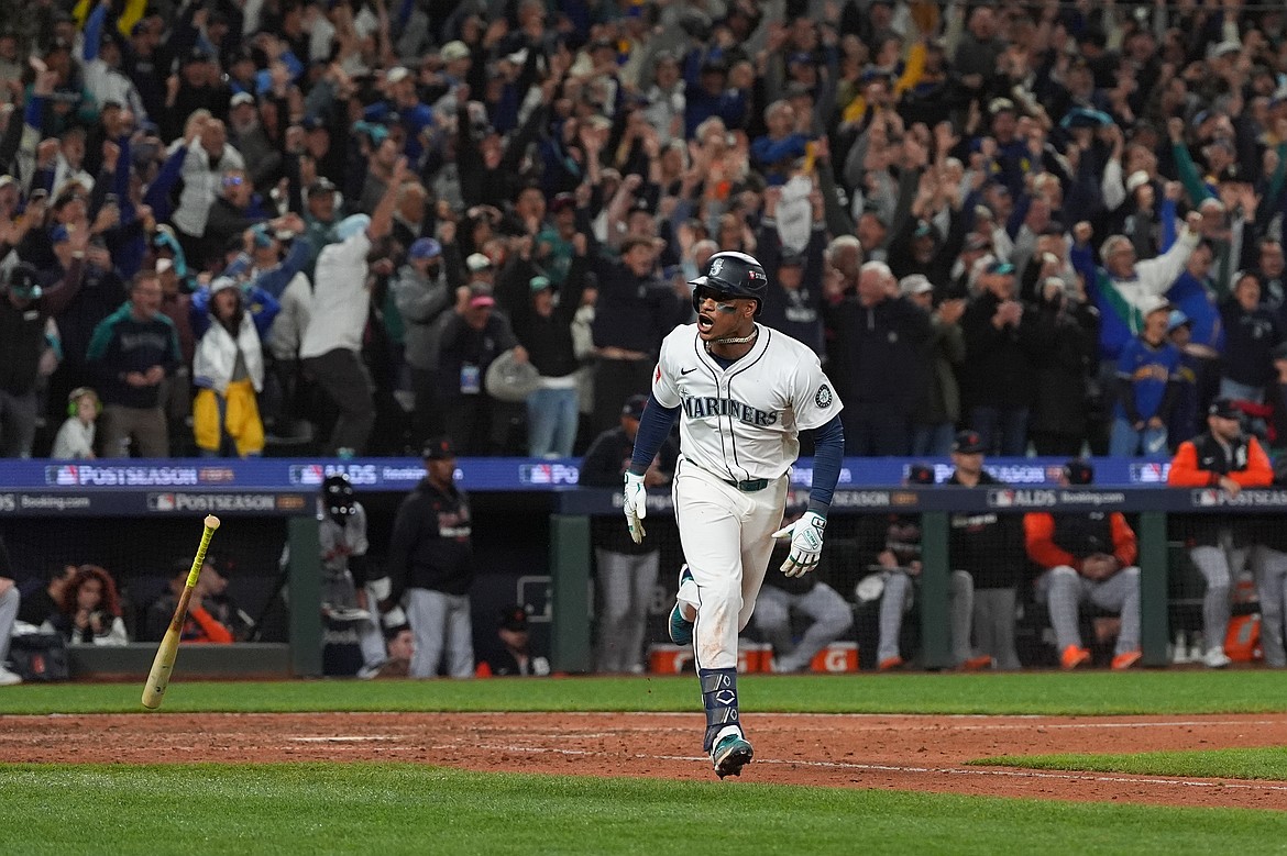Seattle Mariners' Jorge Polanco reacts after hitting an RBI-single for J.P. Crawford to score the game-winning run during the 15th inning in Game 5 of baseball's American League Division Series against the Detroit Tigers, Friday, Oct. 10, 2025, in Seattle.