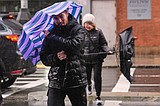 Dozens rescued as remnants of typhoon hits Alaska while nor'easter brings flooding to East Coast