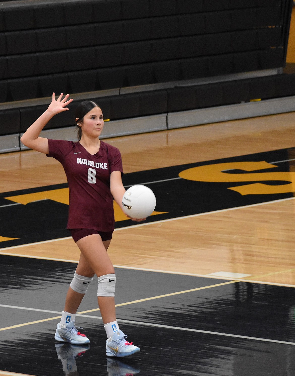 Warriors freshman player Vianae Sandoval prepares to serve against the Knights. Warriors head coach Monica Cortez said the team put up a strong offensive performance against the Knights and showed great improvement since their last encounter.