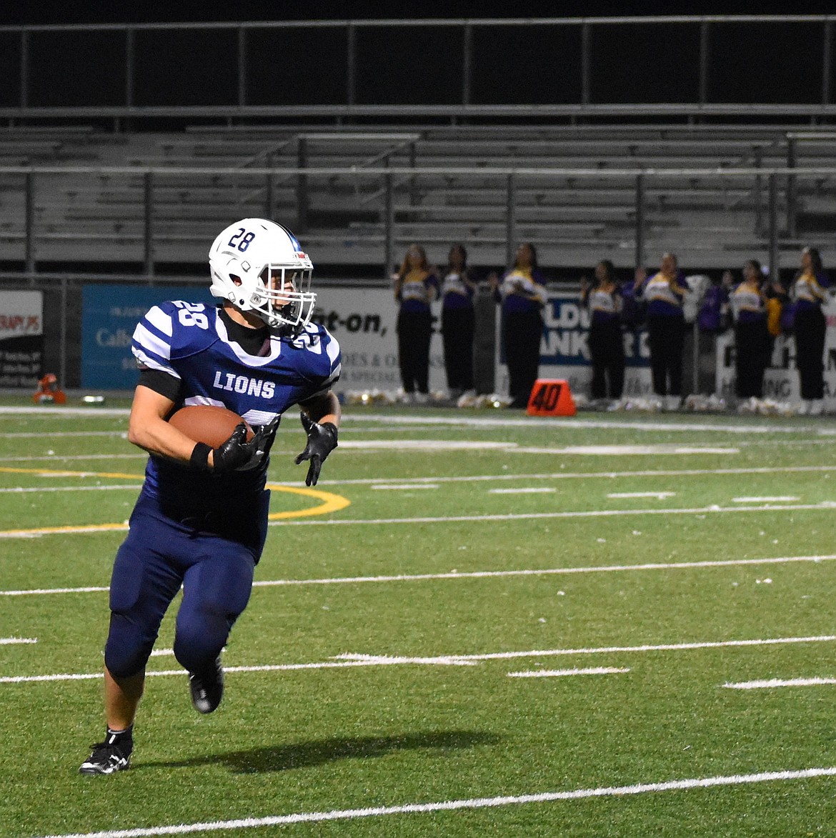 Running back Anthony Moskvich takes off with the ball for a Lions first down. The Lions put up 46 points before the end of the first half against Pateros.