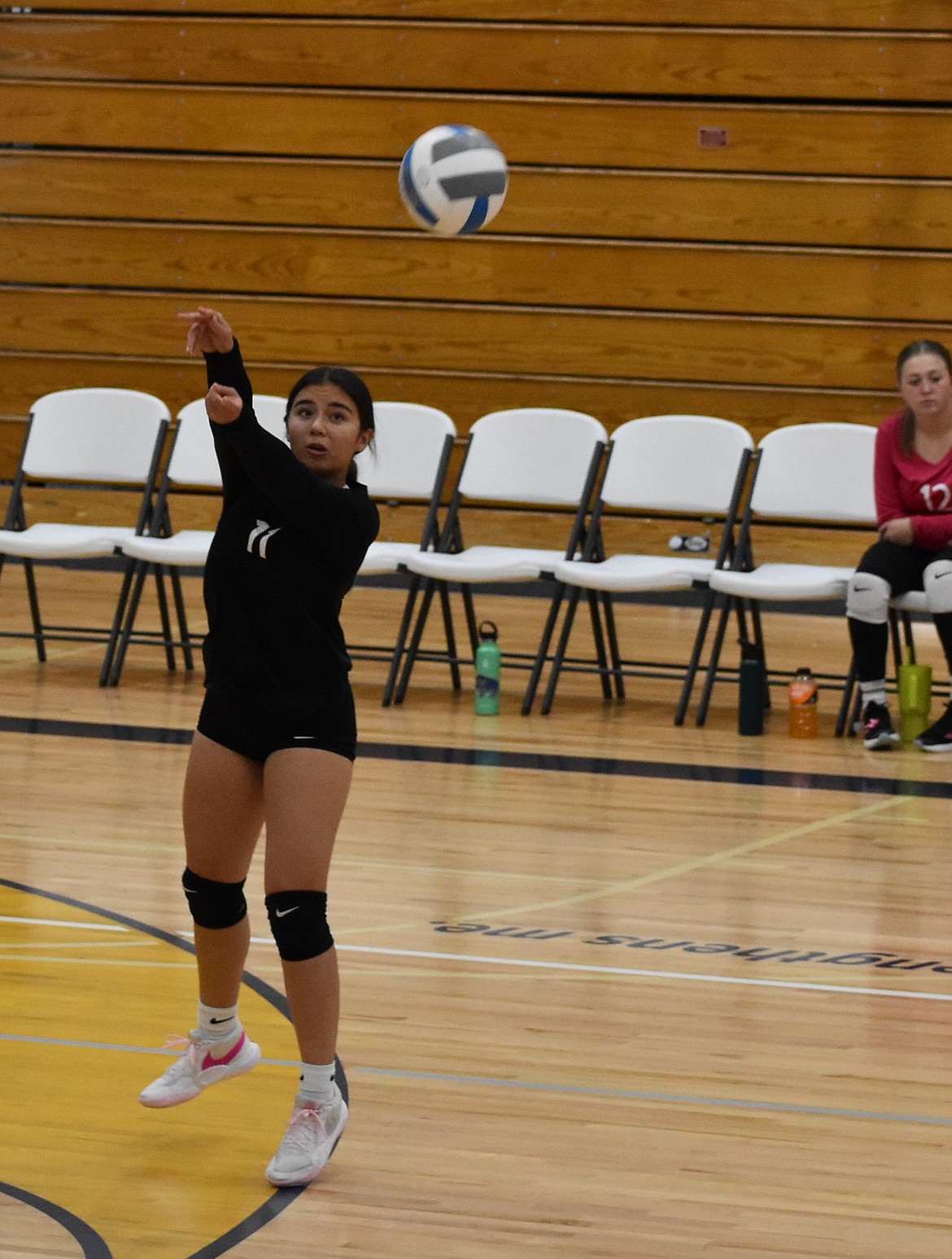 Debi Horn from the Devils sends the ball back over the net during Thursday’s game against the Lions. The Devils will be on the road for their last games of the season.