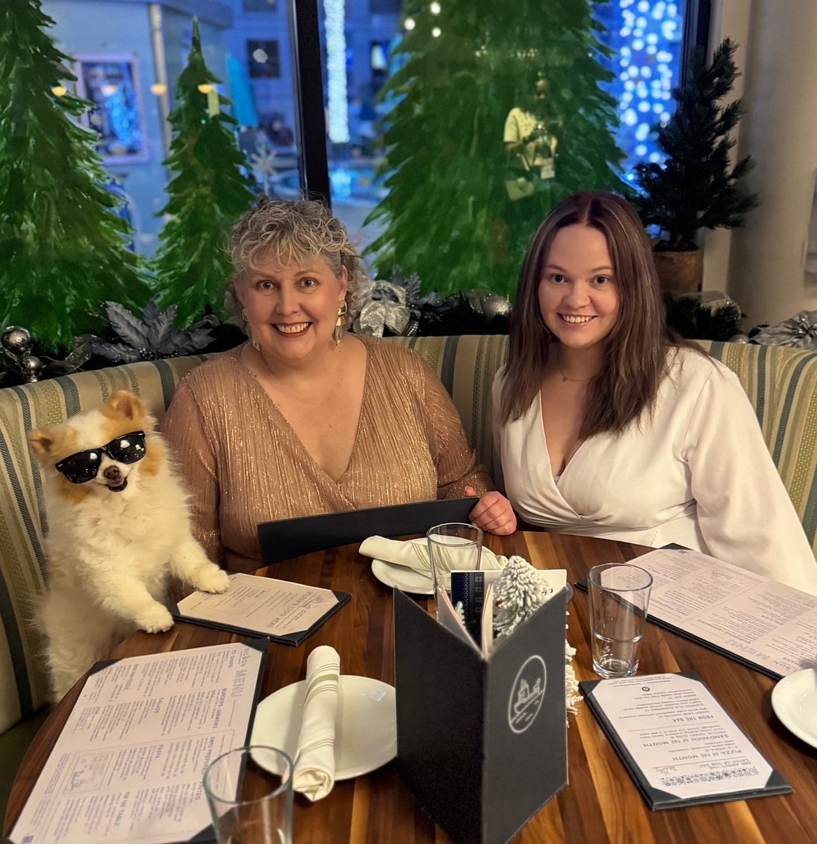 Rebecca Moore, left, and her daughter Katie Moore, right, met Instagram influencer Koda the Fluff during their vacation in Florida. Moore wanted to travel and see more of the world after a year of cancer treatments and discovering she was now cancer-free.
