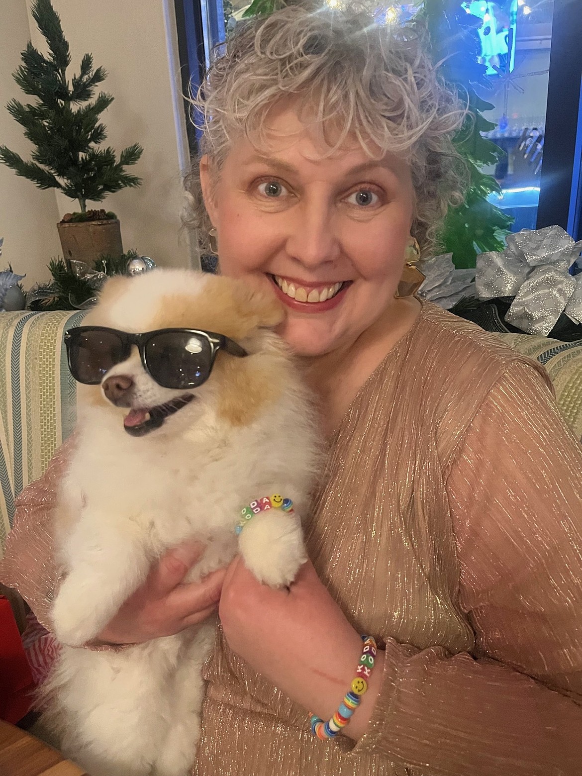 Rebecca Moore and Koda the Fluff pose for a photo. Moore said Koda helped her find the light in some of her darkest days while she was struggling with breast cancer. She has been in remission for almost a year.