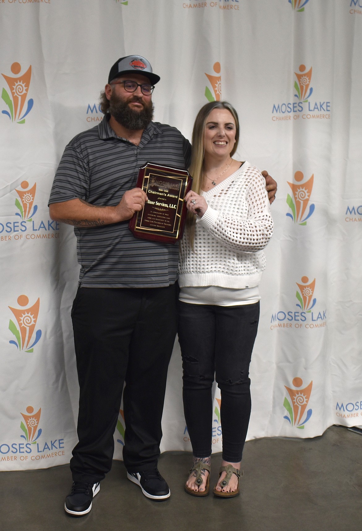 Seth, left, and Rachel Miner received the Chairman’s Award at the Moses Lake Chamber banquet Tuesday for their work in the community and especially on restoring the town fountain.