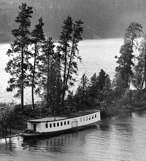 This cropped photo shows Boneta transformed into the Ark Boneta dance and excursion barge after the fire at Ferrell Landing. Owner J.C. White chose not to rebuild it as a steamboat, instead having a long, enclosed structure built on its deck.