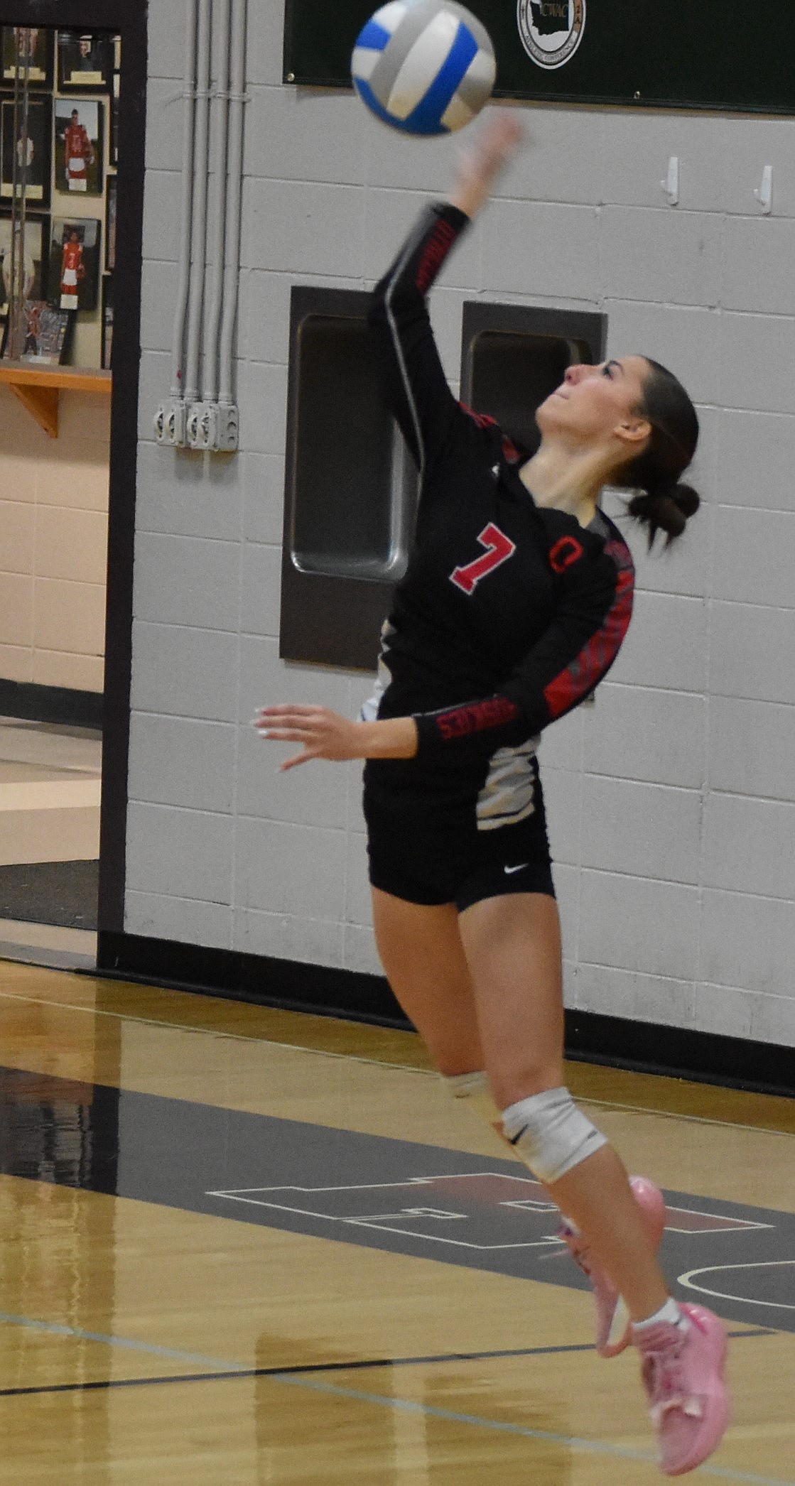 Senior Bella Garza for the Huskies serves the ball during the first set against the Jacks. Huskies senior Chloe Purdy said her favorite memories with the team are when her and Garza would do cheers together.