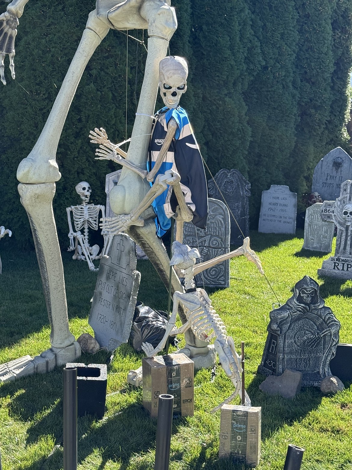 Skeletons play among the tombstones at a festive house at 2684 W. Dawn Ave., Post Falls.
