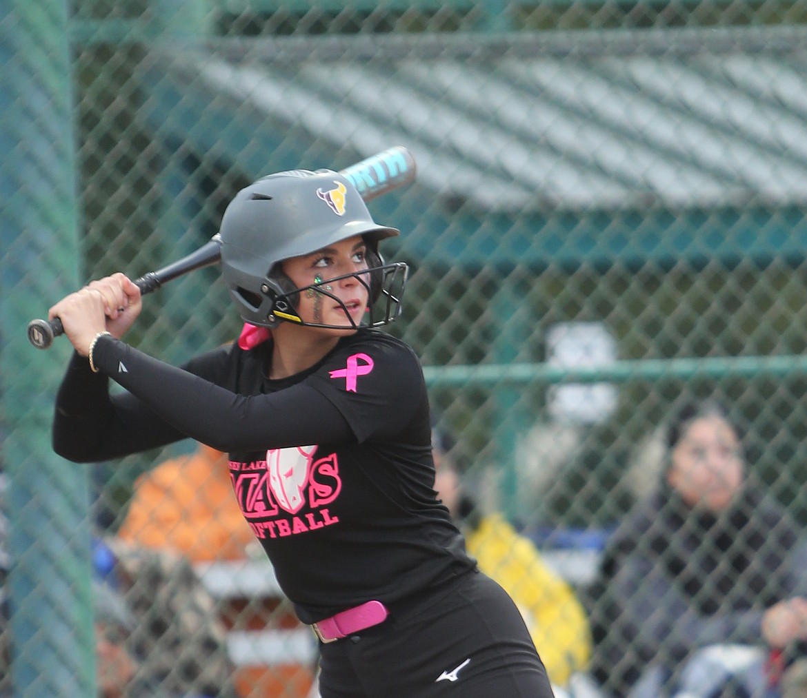 Addi Reffett (21) eyes the ball as she prepares to take a swing at home plate. The Mavericks defeated Skyview 10-6 on Friday to advance to the 4A state championship game.