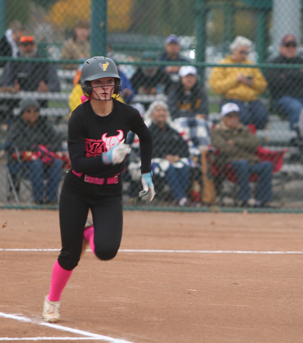 The Mavs’ Lila Johnson (7) sprints to first base against Lake Washington. The Mavericks slowpitch softball defeated Lake Washington 21-0 in the first round of the 4A state tournament game on Friday.