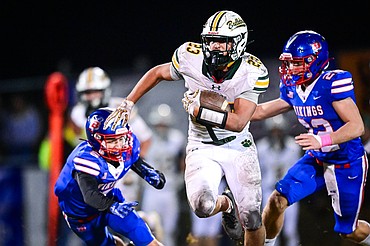 Whitefish running back Cole Moses (23) breaks into the open for a big run in the second half against Bigfork at Bigfork High School on Friday, Oct. 24. (Casey Kreider/Daily Inter Lake)