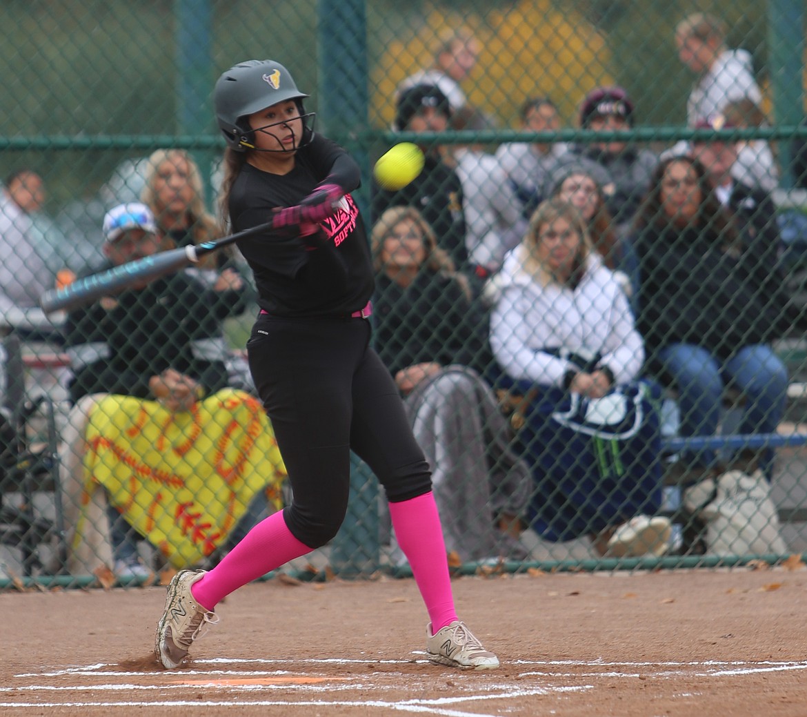 Alina Lopez (20) takes a crack at the ball against Lake Washington on Friday. The Mavericks earned a dominant 21-0 win in the first round of the 4A state tournament.