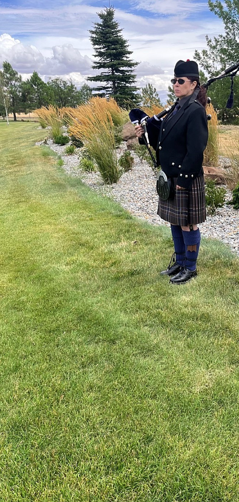 Bagpiper Deborah Cole stands at attention, waiting to play at the Forgotten Heroes ceremony at the Washington State Veterans Cemetery on Aug. 7.