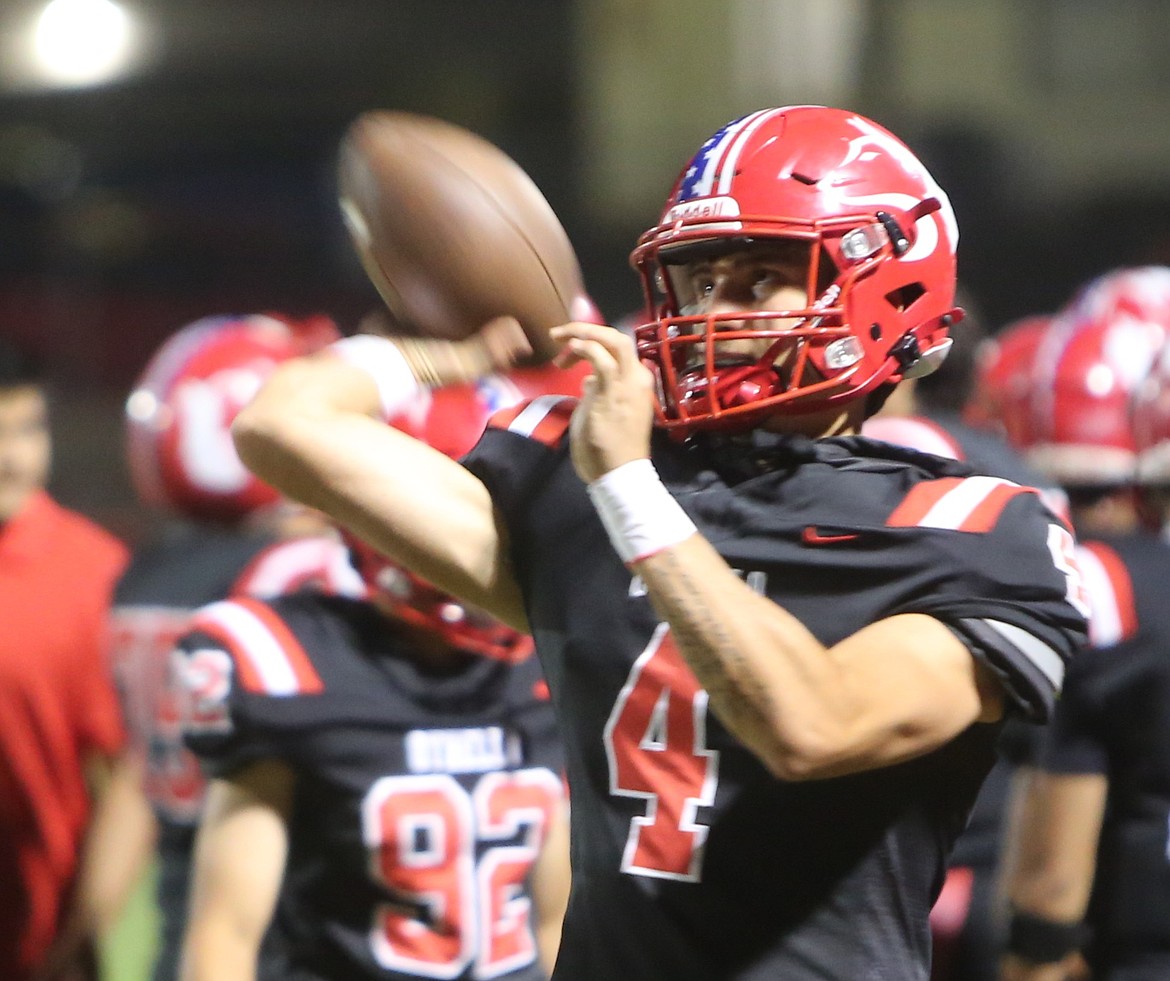 Quade Gonzalez (4) warms up on the sidelines during their game against Selah earlier this season. Defensive Coordinator Kevin Hale said he is hoping to see the Huskies play a clean game against Quincy on Thursday.