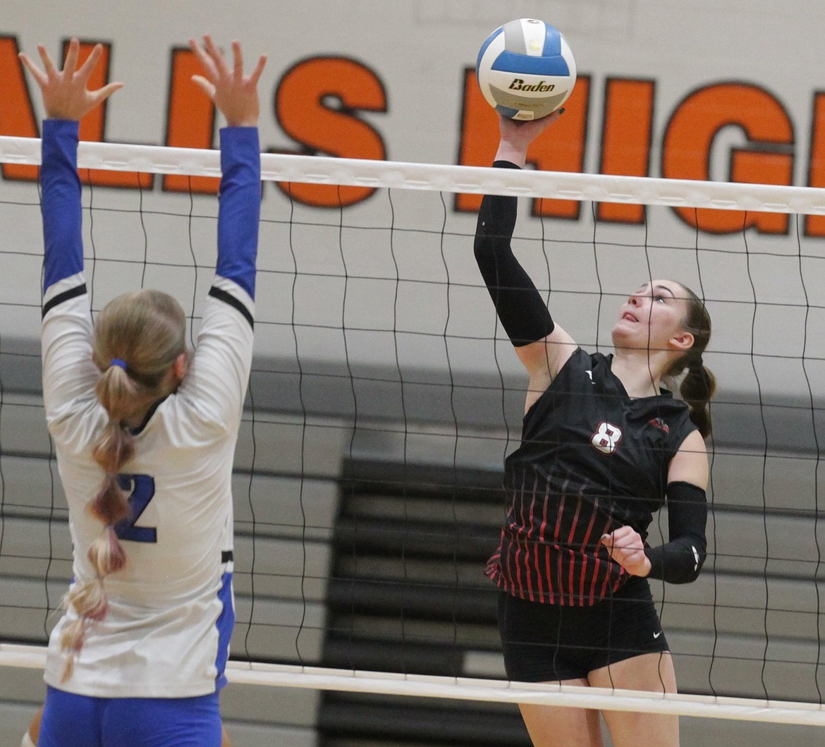JASON ELLIOTT/Press
Wallace senior outside hitter Kylee Phillips attempts to spike the ball past Valley defender Hayli Gordon during an opening round match in the state 2A volleyball tournament at Post Falls High on Thursday.