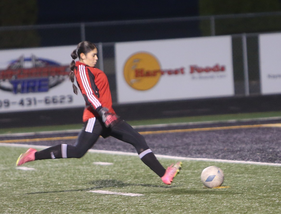 Grace Soliz (1) kicks a penalty kick for the Knights to put them up 5-0.